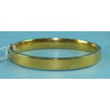A Victorian unmarked yellow gold hinged bangle, 12.9g.