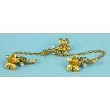 Three Art Nouveau yellow gold brooches, each in the form of a violet flower with pearl set bud,