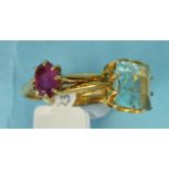 An 18ct gold ring claw-set an oval ruby, size L½, 2.4g, and an unmarked gold ring set pale blue