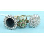 An emerald and synthetic white stone cluster ring in 9ct gold mount and two other synthetic stone