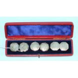 A cased set of six white metal octagonal buttons decorated with horse and rider, two converted to