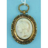 A shell cameo of Athena in yellow metal mount, with locket back, (a/f), 6cm long including loop.