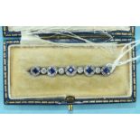 An Edwardian sapphire and diamond bar brooch set a line of five square-cut sapphire and diamond