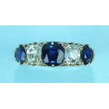 A Victorian sapphire and diamond ring claw set three round-cut sapphires and two old brilliant-cut