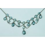A blue zircon fringe necklace set oval and round-cut zircons in white metal frames with trace
