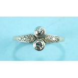 An Edwardian diamond ring collet-set two brilliant-cut diamonds, between diamond-set shoulders, in