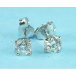 A pair of diamond ear studs, each brilliant-cut diamond of approximately 0.5cts each, four-claw