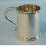 A plain cylinder-shaped half-pint tankard, London 1939, 9cm high, ___7oz.