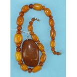 A necklace of graduated yellow and butterscotch amber beads, 29.8g, 40cm long, beads 17mm-5mm and an