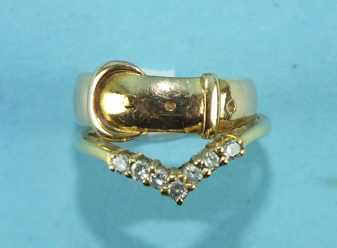 An 18ct gold ring set seven brilliant-cut diamonds, size M½, 2.2g and an 18ct gold buckle ring, size