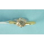 A solitaire diamond ring, claw set an old brilliant cut diamond of approximately .9cts in 18ct