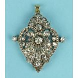 A diamond pendant of stylised heart shape surmounted by a fan set overall graduated old brilliant-