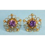 A pair of 18ct gold openwork ear studs, each claw set a round cut amethyst, 1.2cm diameter, 3.3g.