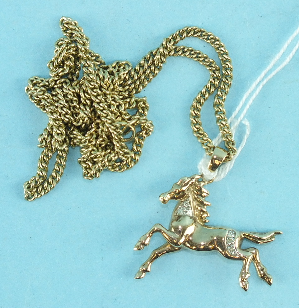 A 9ct gold pendant in the form of a prancing horse, set 8/8-cut diamonds, on 9ct gold curb-link