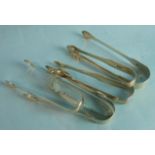 A collection of seven pairs of 19th century sugar tongs, ___6.5oz, (7).