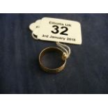 A 9ct gold band ring