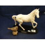 A Royal Doulton horse and a Poole Potter