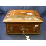 A wooden sewing box with inlaid mother o
