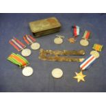 Selection of Medals together with a fire