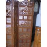 An ornately carved indian screen