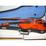 A cased violin with bow