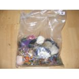 A sealed bag of costume jewellery