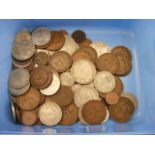 A carton containing a mixed quantity of coins