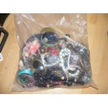 A sealed bag of costume jewellery