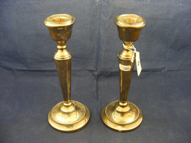 A pair of silver candle sticks