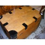 A wooden trunk with metal bands
