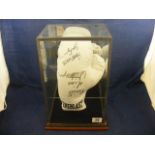 A cased boxing glove signed by Joe Eagan and Tim Witherspoon
