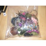 A sealed bag of costume jewellery