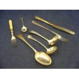 A selection of silver cutlery and flatware to include pierced spoons