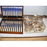 A cased set of cutlery together with a quantity of loose flatware