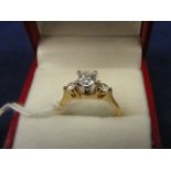 A Diamond three stone approx 80 points in yellow 14ct gold