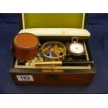 A wooden jewellery box and contents to include RAF badges, guiding badges,