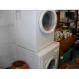 An indesit washing machine together with a white knight tumble drier