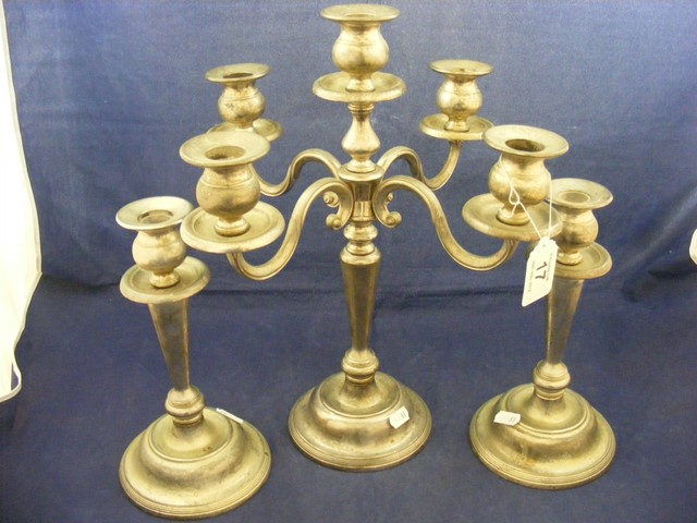 A pair of EPNS candle sticks together with a candelabra