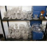 A large quantity of crystal glassware to include waterford on two shelves