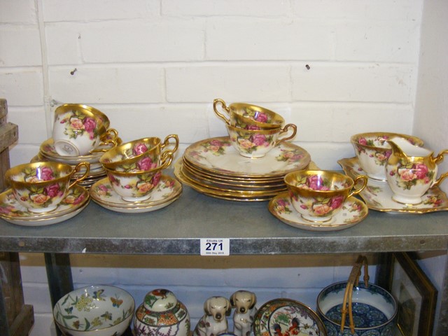 A quantity of Royal Chelsea golden rose teaware