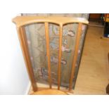 An Ercol hanging shelf unit