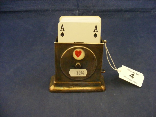 A silver playing card holder