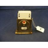 A silver playing card holder
