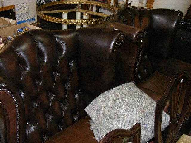 Two wingback leather armchairs