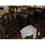 Two wingback leather armchairs