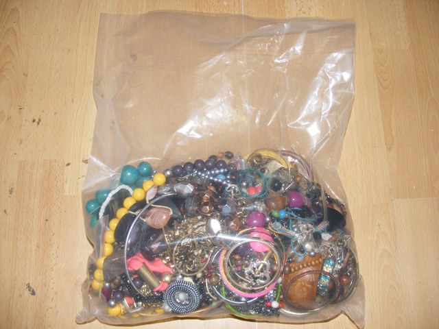 A sealed bag of costume jewellery