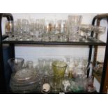 A collection of mixed glassware on two shelves
