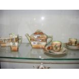 A Royal Doulton Dickens Ware part tea set comprising of teapot, milk jug,