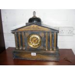 A slate mantle clock with key