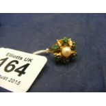 A 9ct gold pearl and emerald ring